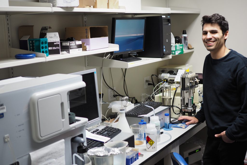 Dr. Mazdak Bradberry smiles for the camera while working.