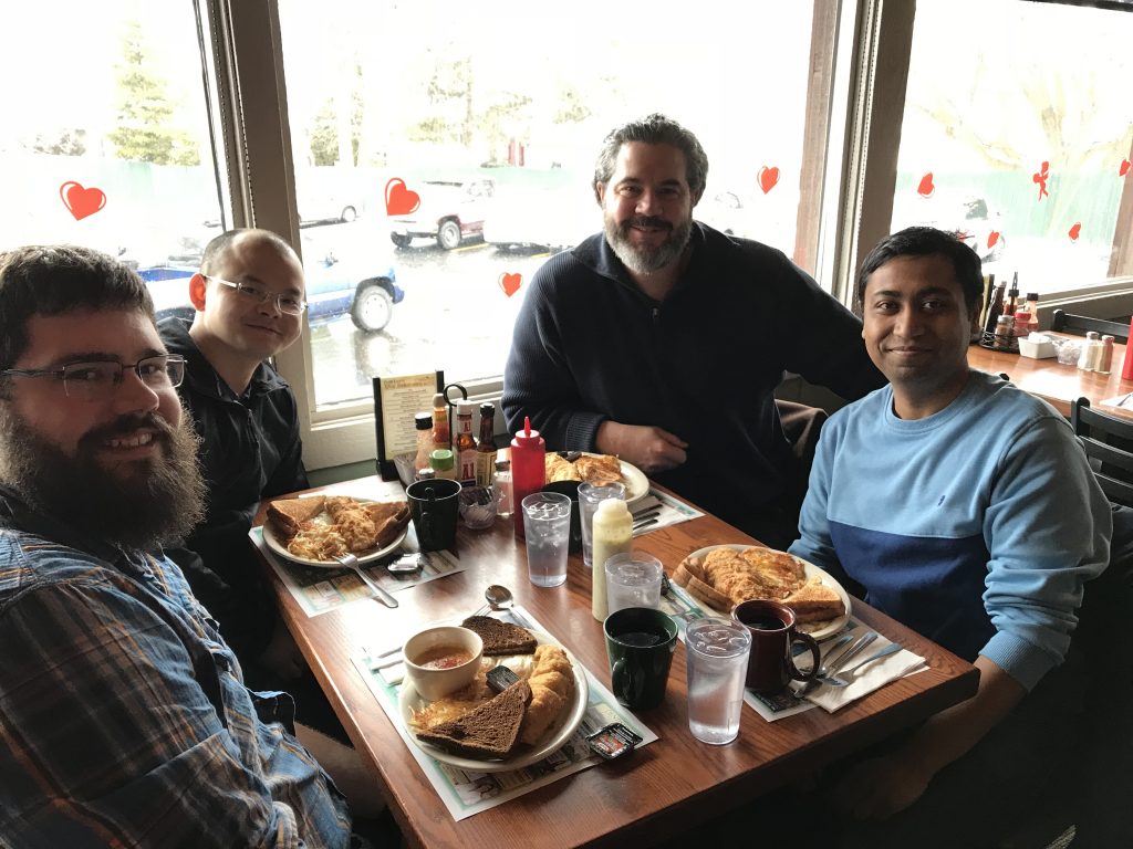 Dr. Ed Chapman and lab members at breakfast. 