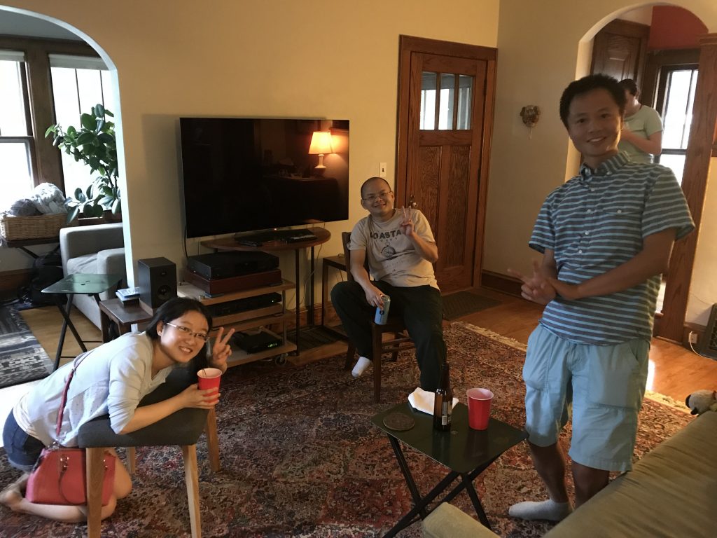 Lab members pose for the camera in Dr. Ed Chapman's living room.