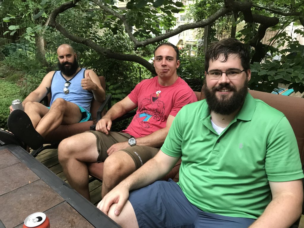 Lab members smile for the camera on Dr. Ed Chapman's deck.