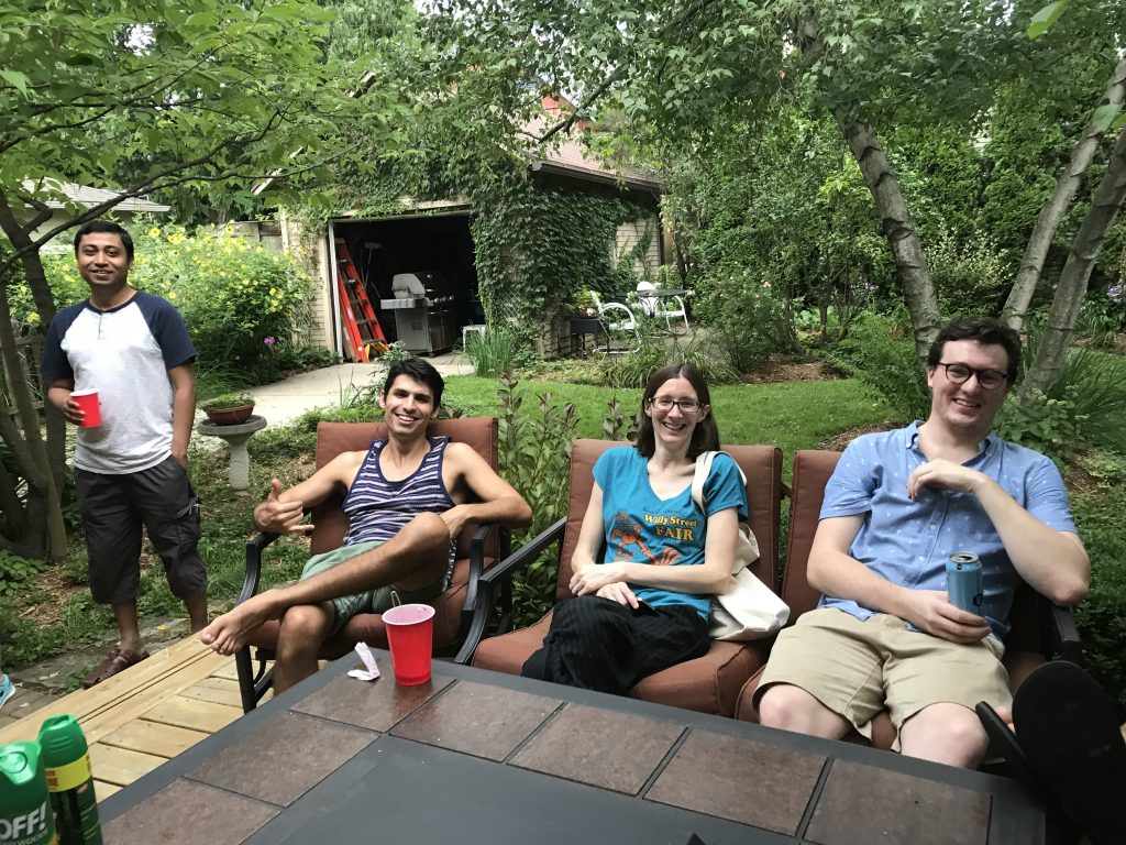 Lab members smile for the camera on Dr. Ed Chapman's deck.
