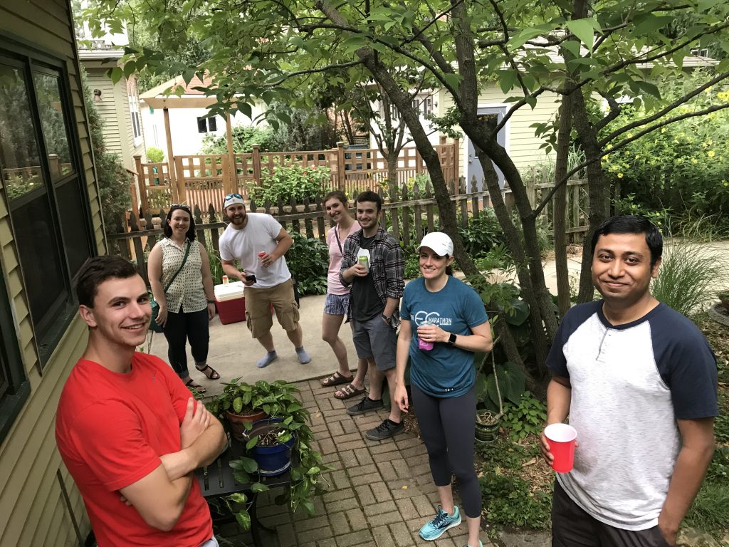 Lab members smile for the camera on Dr. Ed Chapman's deck.