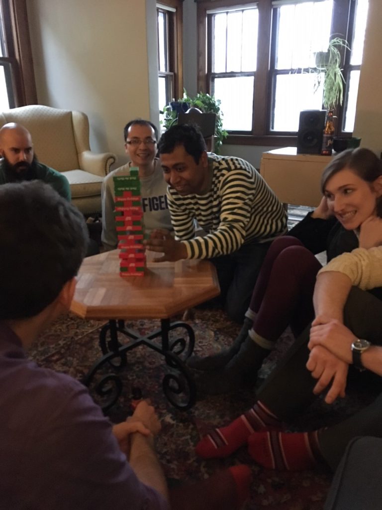 Dr. Debasis Das makes a risky pull of a Jenga block. 