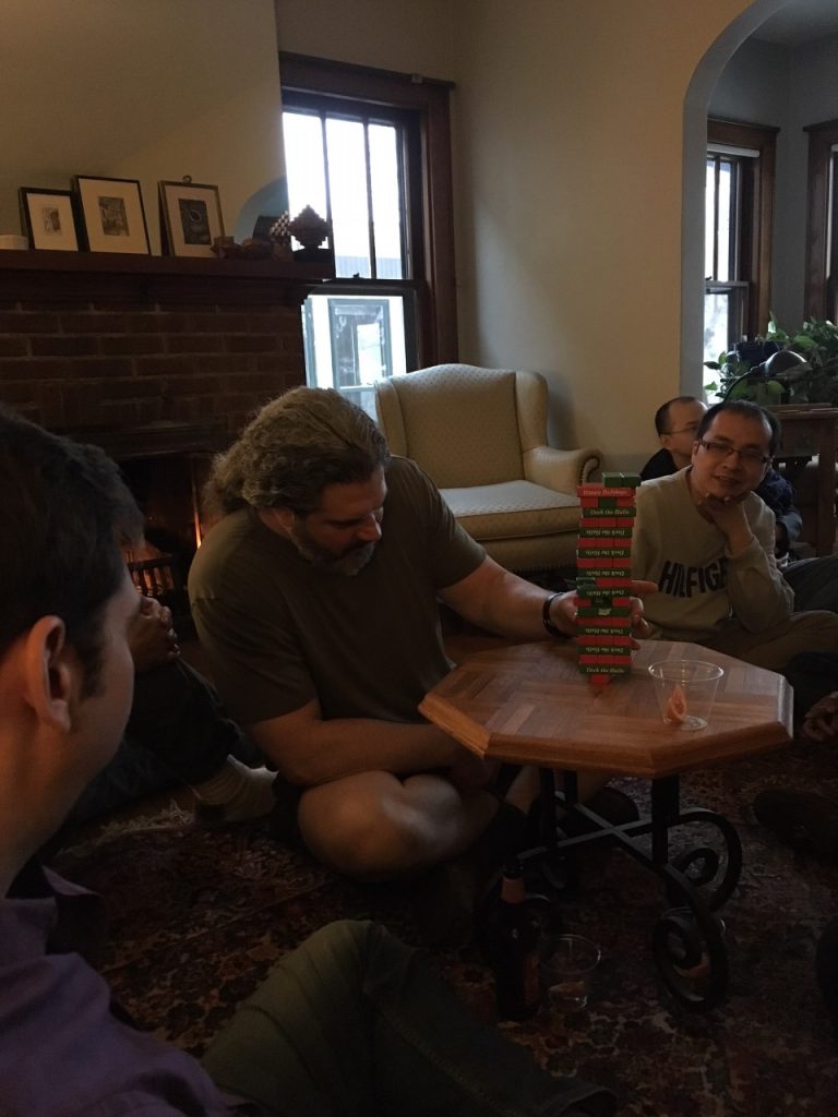 Dr. Ed Chapman attempts to pull a block during a game of Jenga.
