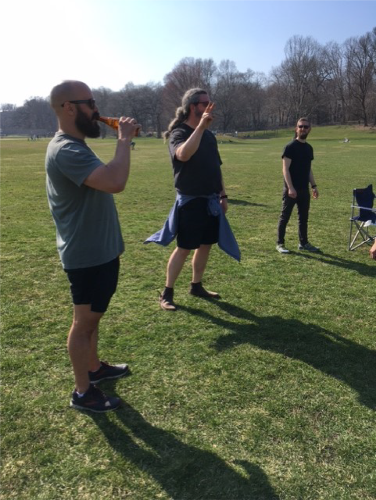 Dr. Ed Chapman throws a peace sign in the park.